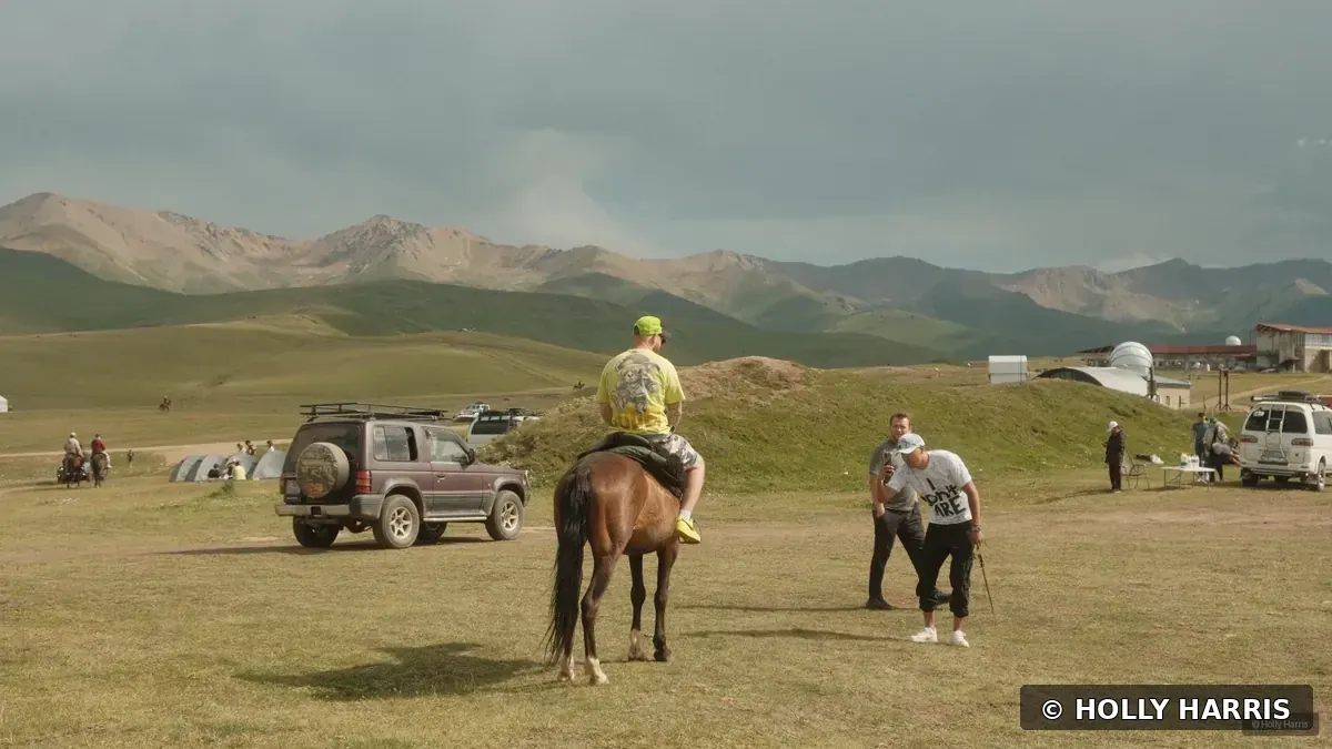 Horse rider in a mountain valley in the Tian Shan Mountains of Kazakhstan