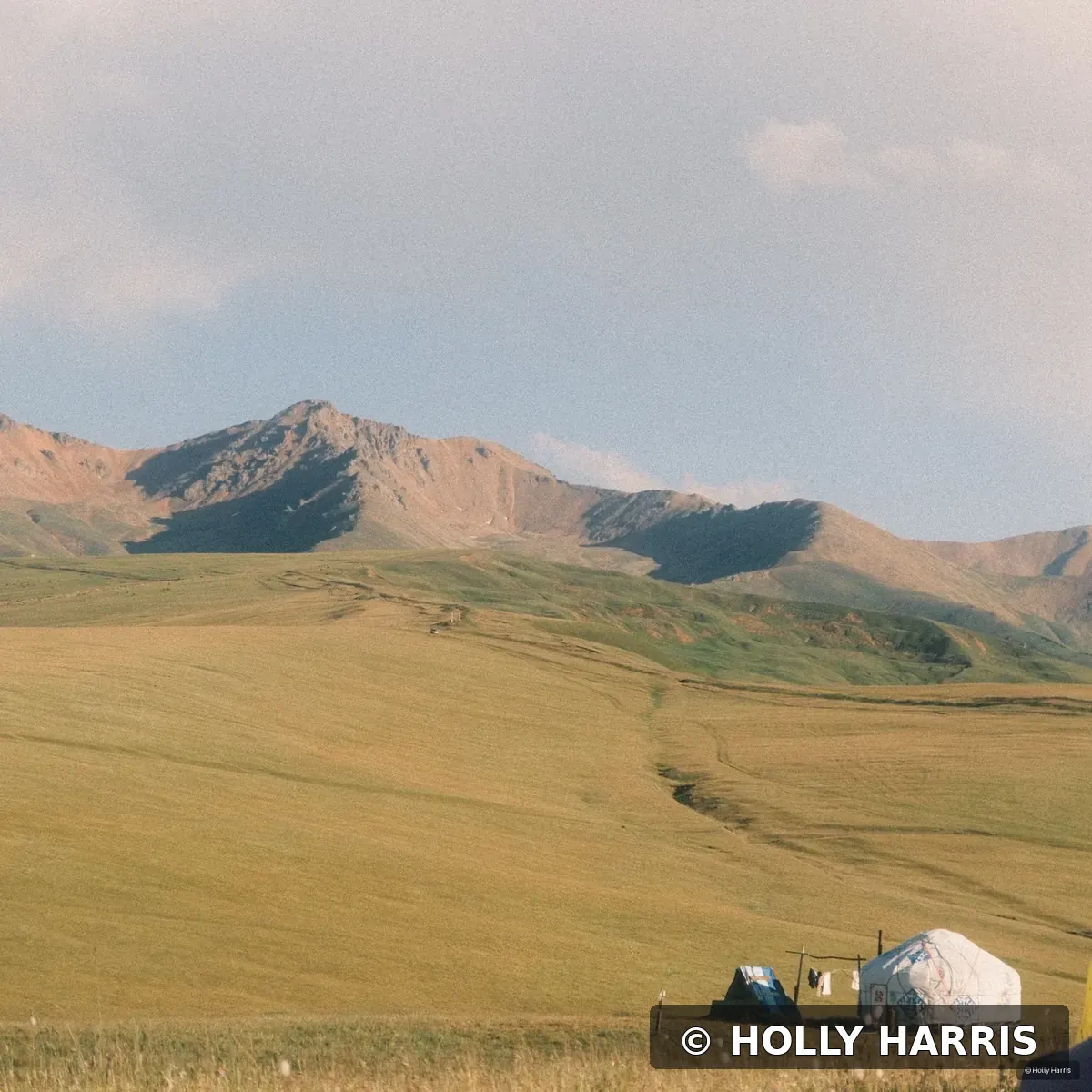 Yurt beneath mountain ridges in the Tian Shan Mountains of Kazakhstan